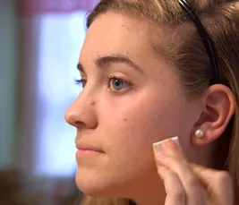 girl applying makeup