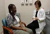 woman speaking with doctor