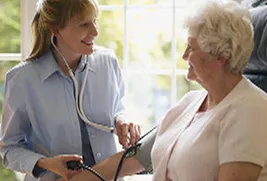 older woman getting blood pressure measured