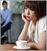 Woman staring into space with coffee