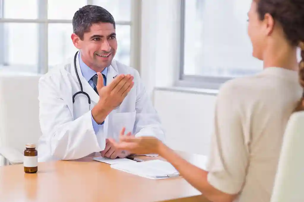 photo of doctor in discussion with patient