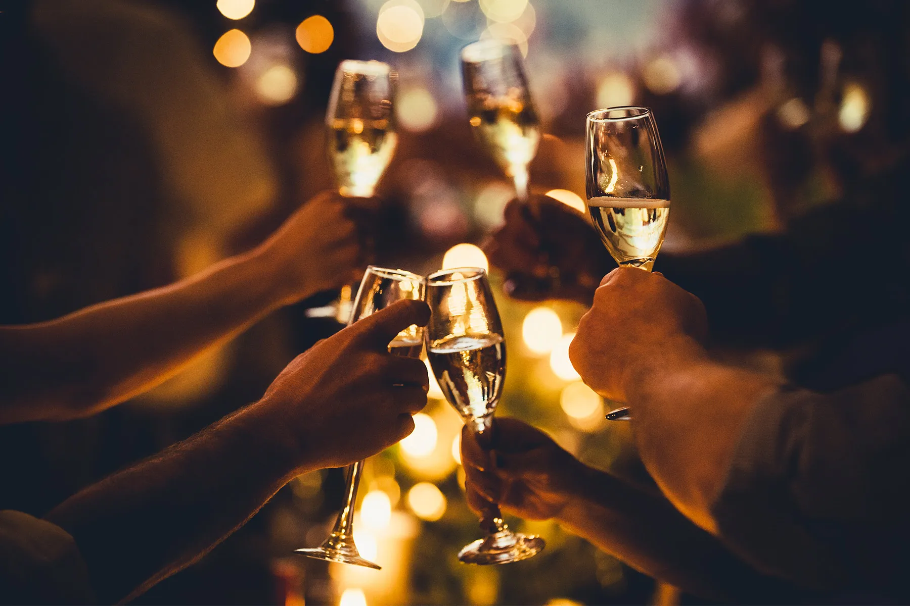 Photo of people toasting with champagne
