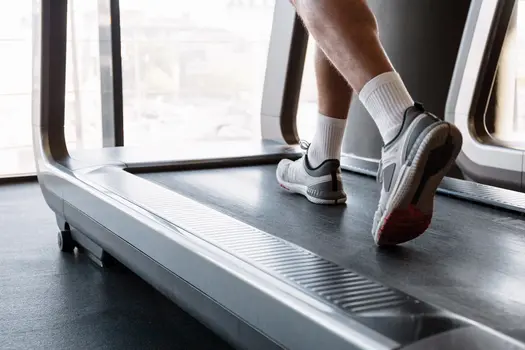 photo of male athlete running on treadmill