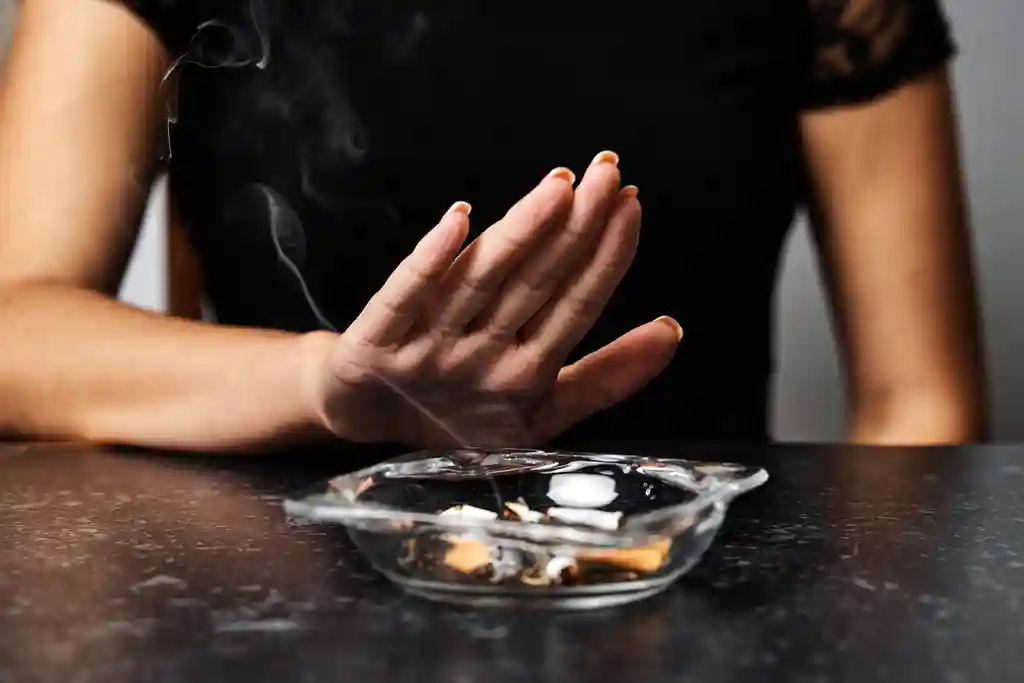 photo of young woman refusing smoking