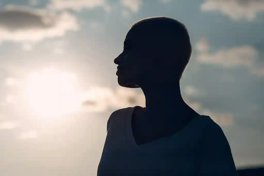photo of woman's silhouette at sunset