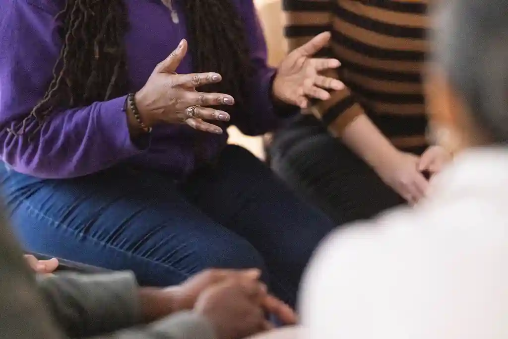 photo of woman sharing with support group