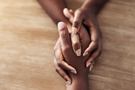 photo of holding hands for support