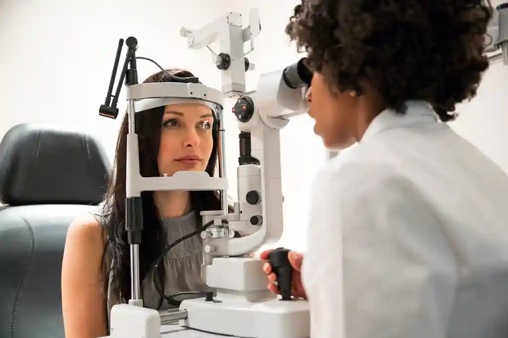 photo of woman having an eye exam
