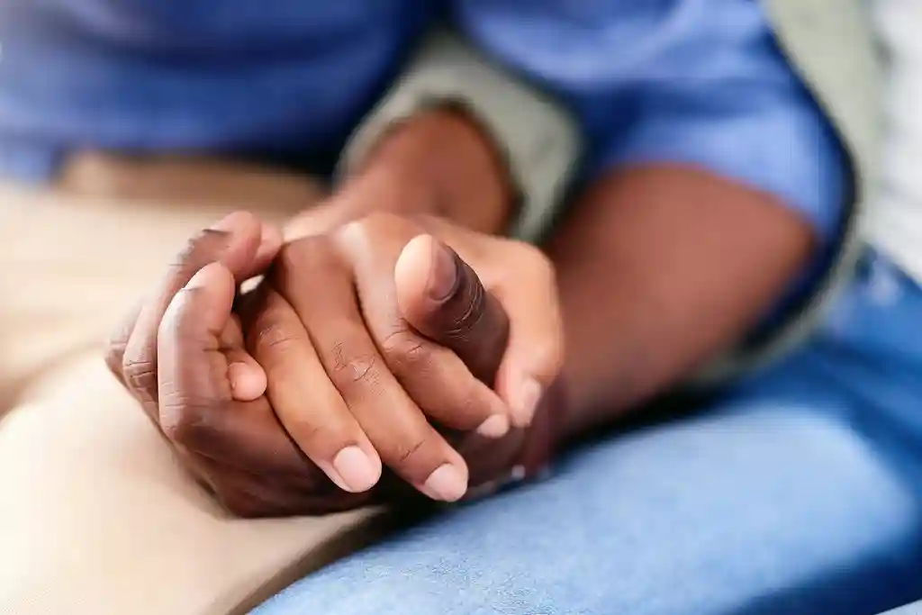 photo of close-up of couple holding hands