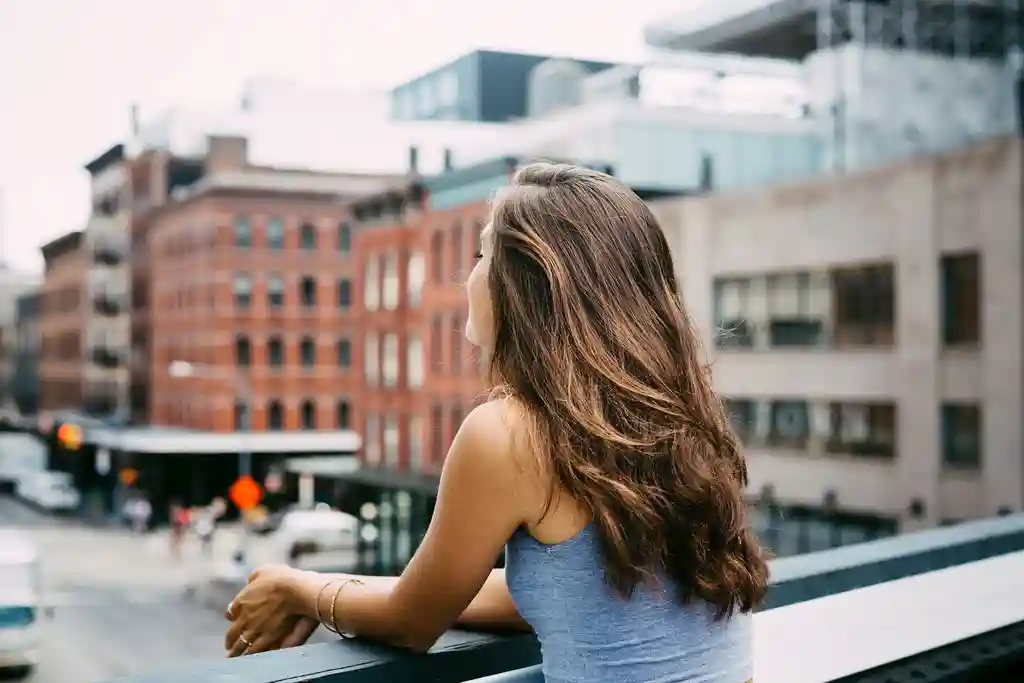 photo of woman enjoying view of the city