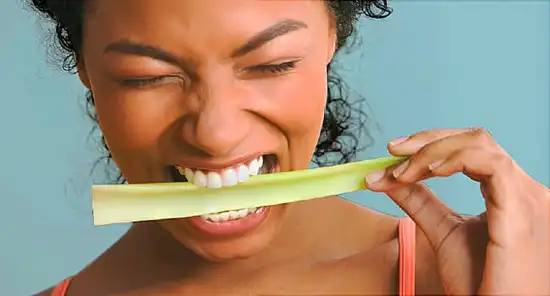 woman eating celery