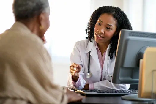 photo of patient chatting with doctor