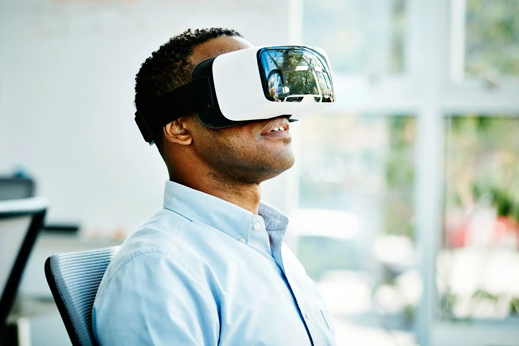 photo of man wearing virtual reality headset