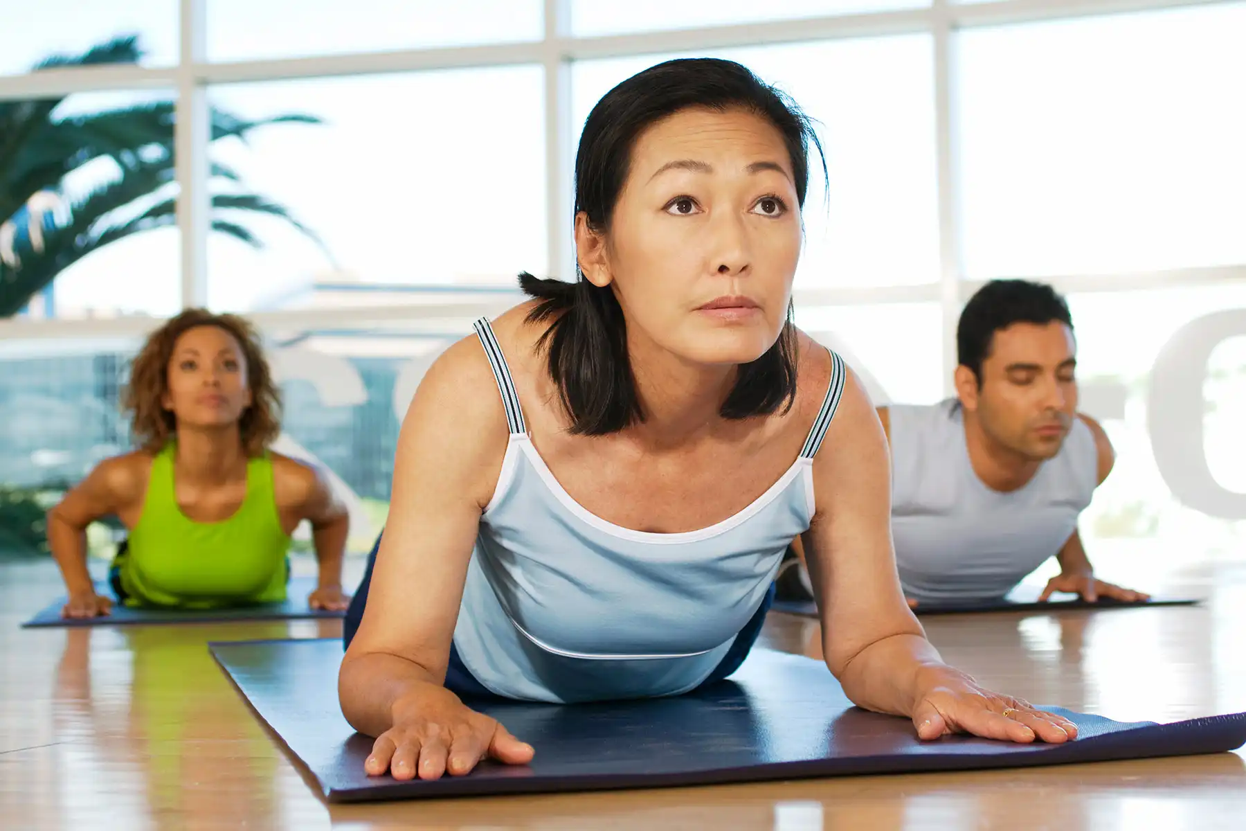 photo of mature woman in yoga class