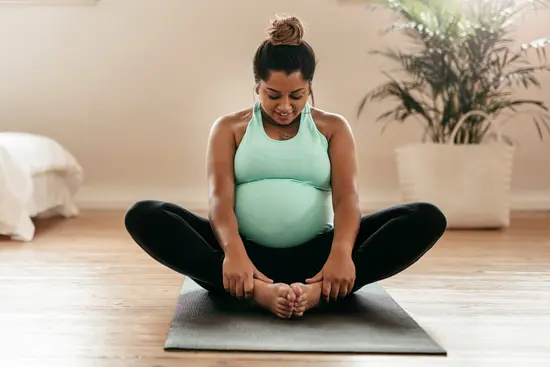 photo of pregnant woman exercising