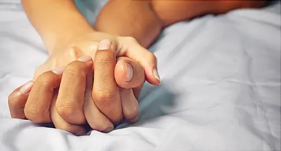 passionate hands on bed