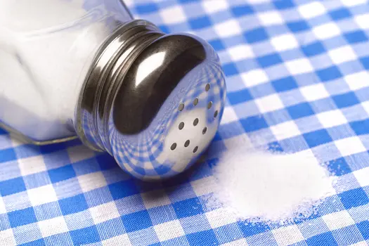 photo of pile of salt on a table cloth